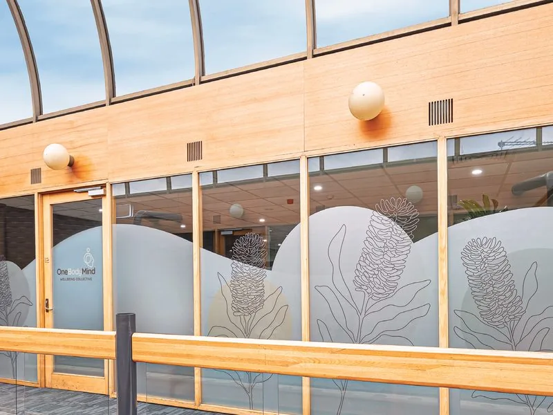 Exterior of the practice with frosted botanical window graphics
