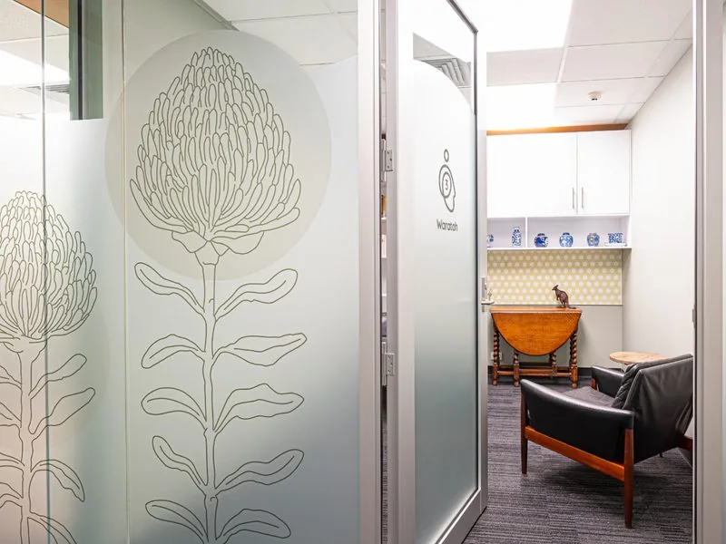 Suite entrance with botanical glass graphic