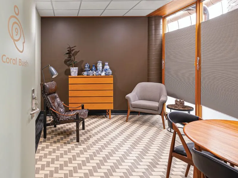 Deluxe suite with timber sideboard and armchairs